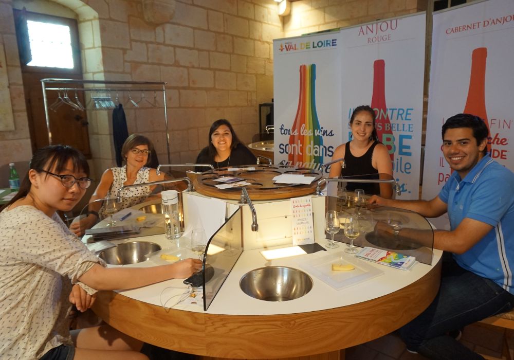 A group of friends enjoying time together at a table.