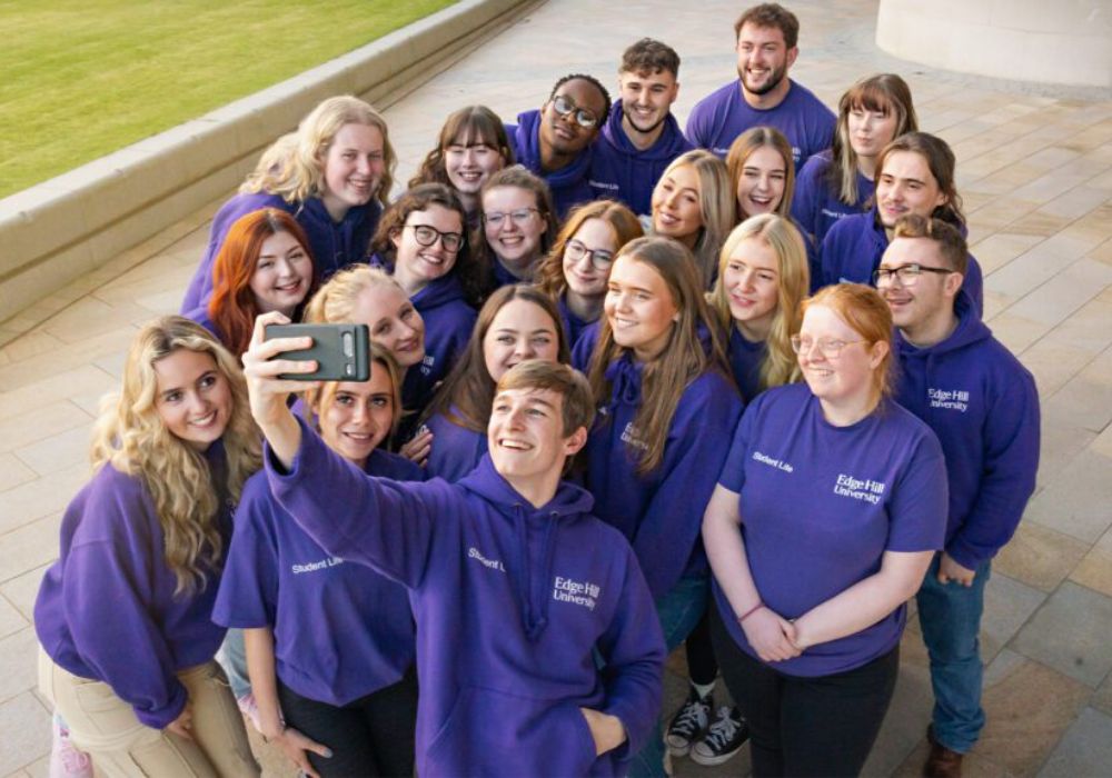 Students at Edge Hill University posing for a group photo.