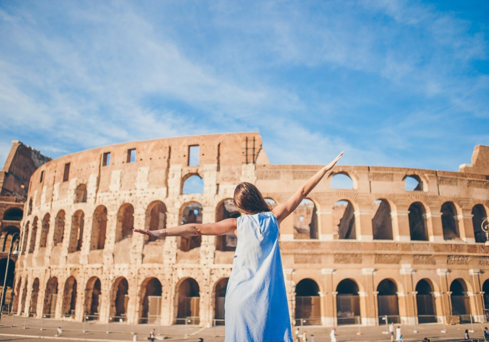 A student in Italy in front of the Colosseum in Rome.